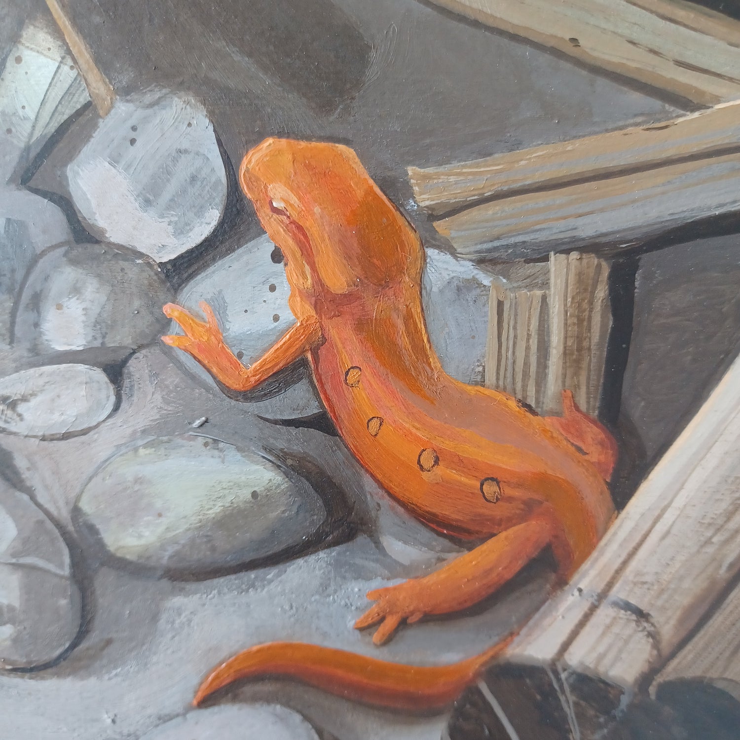 An acrylic painting featuring a orange salamander. 
