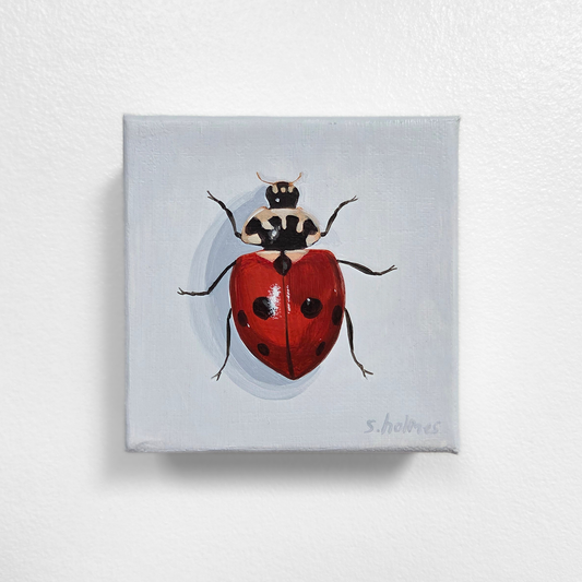 Painting of a ladybug on a light gray background